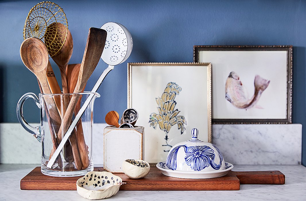 A few small paintings and ceramics add charm to Kate’s kitchen.
