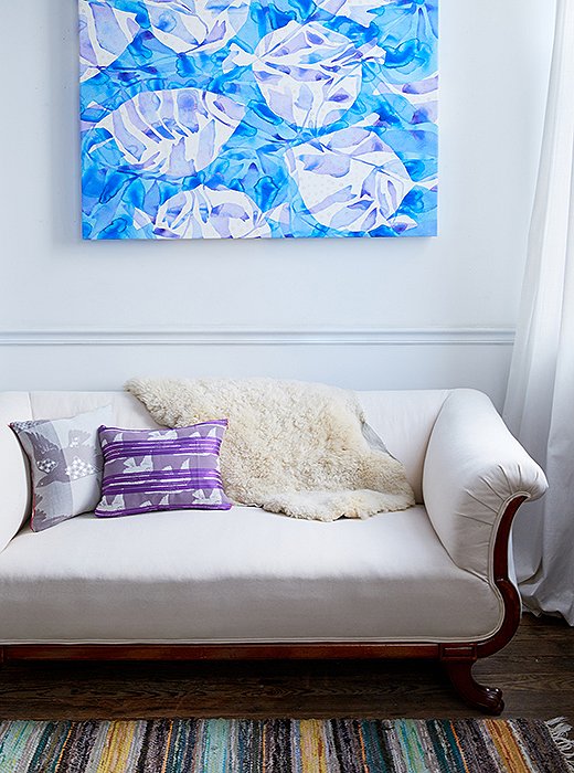 An antique settee provides a cozy place to hang when Kate takes breaks from painting.
