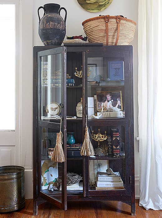 A pair of silk tassels add a bit of polish to an industrial cabinet.

