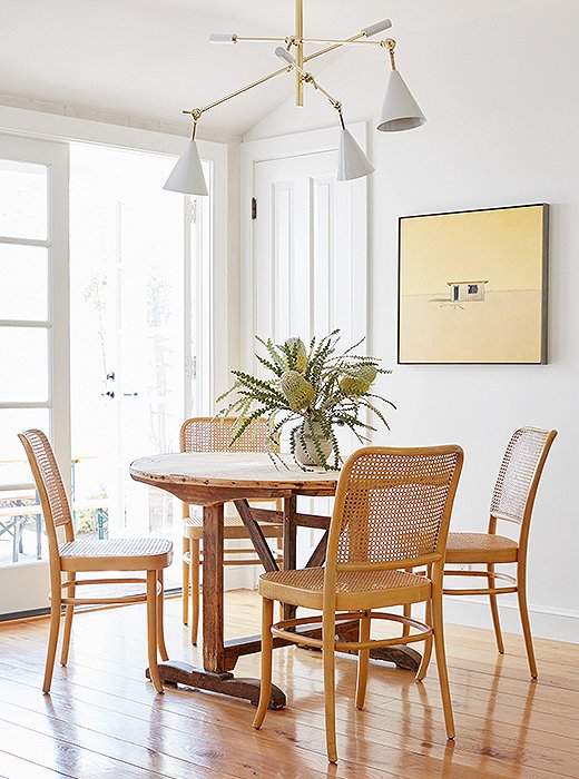 “The vintage Hoffmann dining chairs are so classic and chic. I love them,” Alex says. Juxtaposed with the French barn table, they “bring more texture and character to the space, without a ton of color.”
