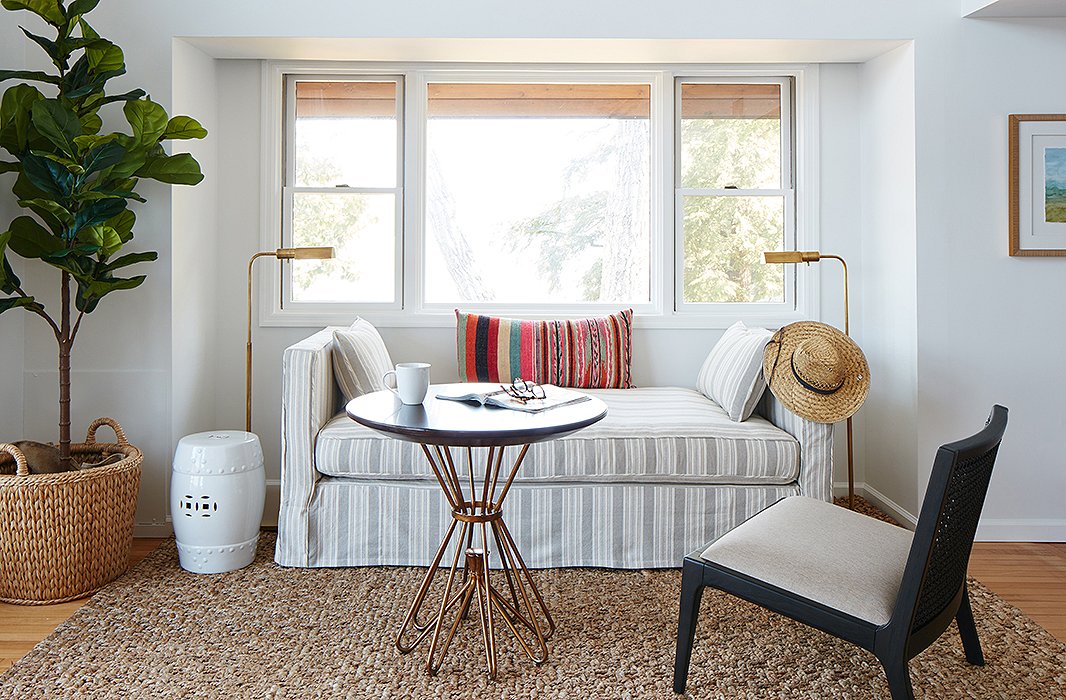 The daybed performs double duty as an area for morning coffee and an extra sleeping spot. The garden stool serves as a petite nightstand or a place to rest a book.
