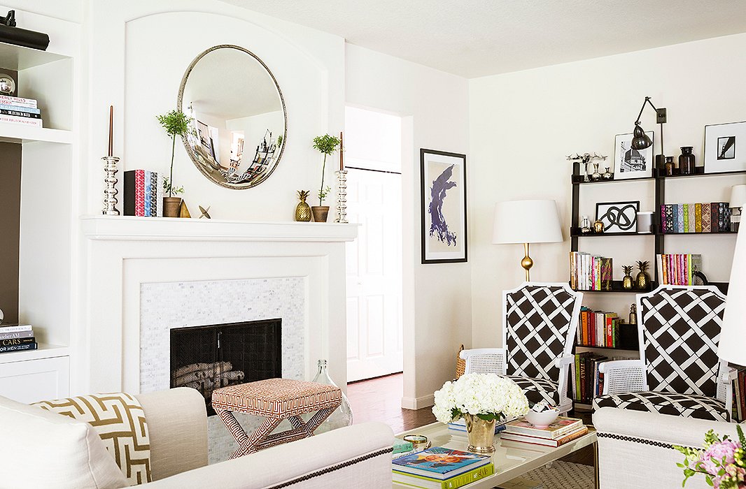 Paloma played with pattern in the space. “The chairs are 1940s, and we had them recovered in a fun bamboo print,” she says. “I designed the fabric used on the upholstered stools.”
