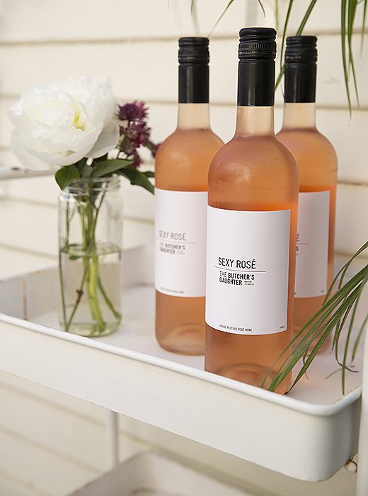 Chilled bottles of wine are at the ready. “I like to stick to one or two drinks,” says Whitney. “And keep them simple. For an early-fall party, rosé is a perfect day-to-night drink.”
