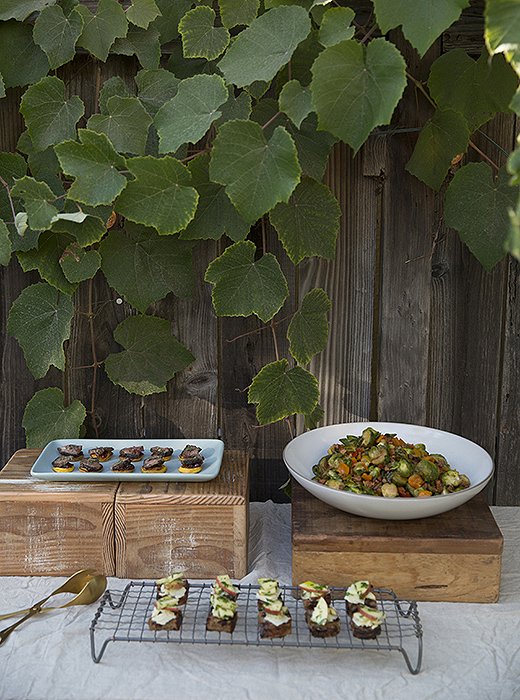 From flowers to decor to party food, Whitney likes a natural vibe. Here, appetizers are displayed on vintage wooden boxes and a wire cooling rack.
