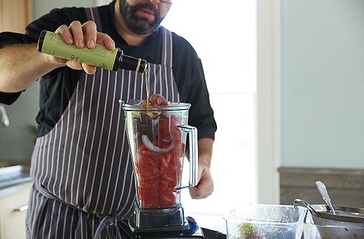 Add the purée bowl’s contents into the Vitamix along with a stream of olive oil. Blend thoroughly into a true purée, then pour the contents onto the diced vegetables (you may need a larger bowl to combine both).
