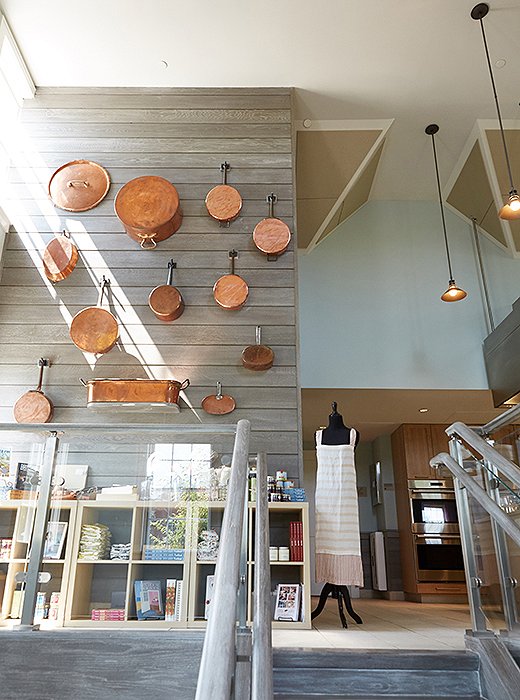 The Nantucket Looms chose a gray wash over reclaimed oak, along with a collection of antique and new copper pots, for the staircase leading up to the Culinary Center’s top floor, where many cooking classes are held.
