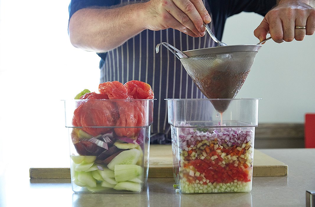 Greg’s gazpacho recipe, honed over perhaps thousands of gallons, hinges on two things: knife skills and a balance between puréed liquid and diced vegetables.
