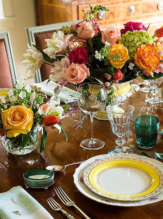 Vibrant and polished, Julia’s impeccably set dinner table beautifully represents her affinity for the high-low mix. “I’ll use heavy 19th-century French wine goblets from Lucullus <a favorite antiques store in the French Quarter> with thin water glasses, sometimes in color, from, say, CB2.”