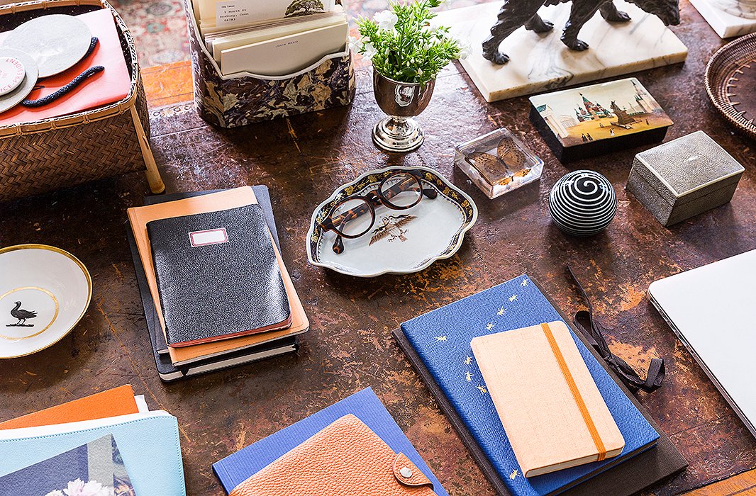 Stacks of notebooks grace writer Julia Reed’s leather-top desk. Photo by Lesley Unruh.
