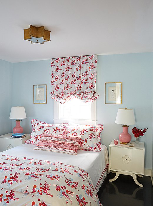 Cheery D. Porthault linens give daughter Mary Jane’s room its fanciful flair. To make the most of the print, Elizabeth had balloon shades made to match. The ceiling fixture (almost identical to the Sophia Flush Mount) and the powder-blue walls keep the space from feeling excessively frilly. “The fixture is almost like something that could be in a ’50s diner,” notes the designer. “But when you take it out of that context, it becomes almost nautical.”
