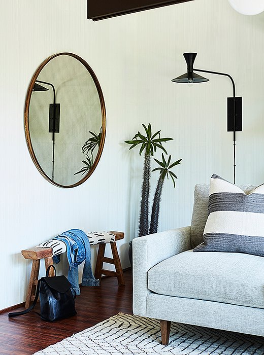 The house is on the tiny side—the front door opens right up into this main room. A rough-hewn wood bench gives it a bit of bohemian Bolinas spirit to set the tone.
