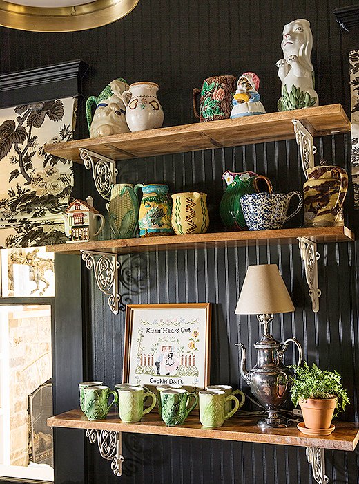 Bailey removed the kitchen island, leaving room for a coffee bar. Open shelves display vintage pottery that her mother has collected over the years. “I love adding to it with my own finds,” Bailey says.

