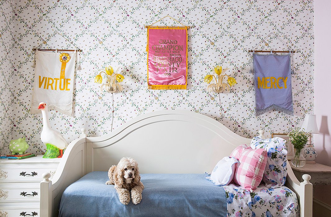 “I love all of the collections of items from my childhood mixed with our vintage finds,” says Bailey. “In Grace’s room there are some vintage flags I found at the Round Top Antiques Fair, as well as some framed Peter Rabbit etchings that were in my nursery.”
