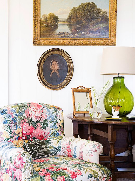 The living room’s art is an eclectic mix of local finds, such as the Mary H. Case painting above the fireplace, and family heirlooms, including a portrait of Bailey’s great-great-grandmother “It’s actually superspooky,” she laughs. “I like the mix of the family heirloom, the more modern piece, and the really traditional landscape.”
