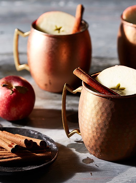 Garnished with an apple slice and a cinnamon stick, these apple cider Moscow mules taste as good as they look.
