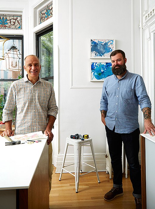 David Kassel and Chris Deo of ILevel, fresh off hanging the pair of toddler paintings behind them.
