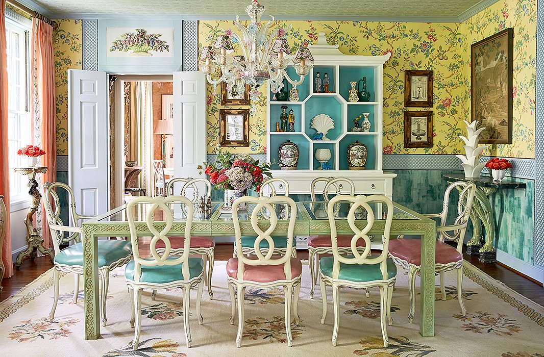 The dining room is an homage to Bar Longhi at the Gritti Palace hotel in Venice. “You sit in that bar and you feel like you’ve been whisked away to this magical world,” Jason says. “We wanted to recreate that experience in our own home.” The designers mixed a Murano glass chandelier and antique floral plasterwork with a glass-top table and chairs from eBay for an elegant but approachable space. “It’s a more formal dining room, but it’s a glass-top table, so nothing feels stuffy,” says John.
