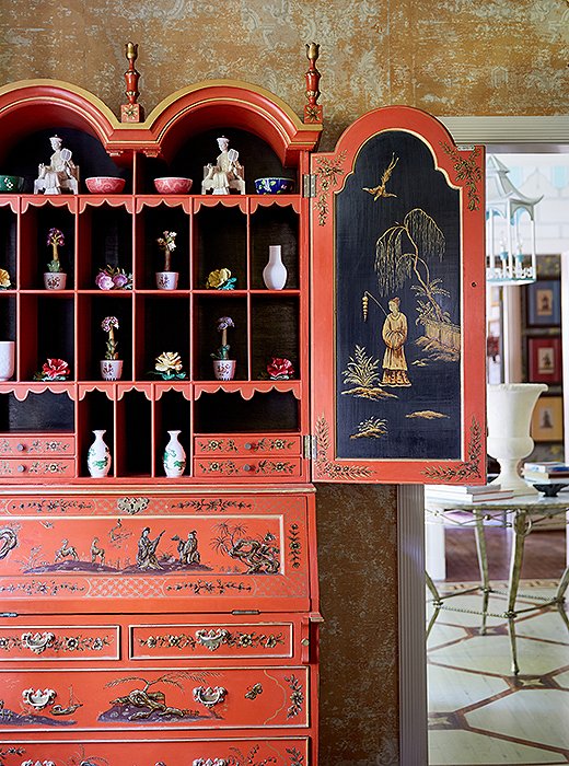 Jason and John filled the “dragon-lady red” lacquered secretary with a collection of porcelain flowers. “That piece is a little more decorative, but we also use it as a writing desk,” says Jason.
