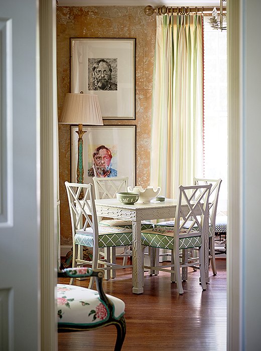 The designers set a card table and chairs in a corner of the living room as a second seating area. “We love a good card table,” says Jason. John adds, “The great thing about a card table or a game table is that it prompts you to play cards or sit down and do something that doesn’t involve your computer or your phone.”
