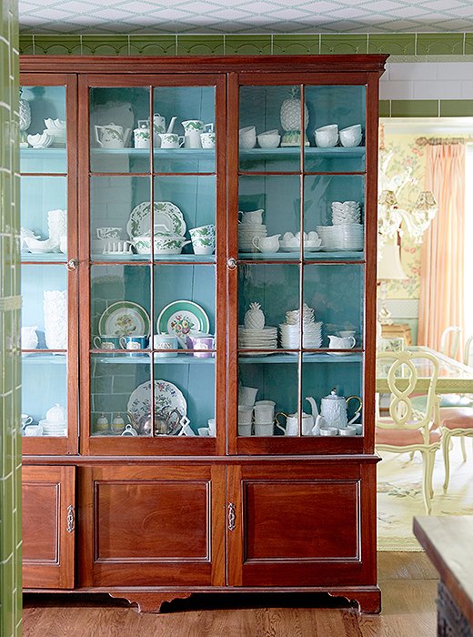 The designers installed an antique library cabinet to store and display their china. “It’s another great place to show our collection and try things that are right at your fingertips,” Jason explains.
