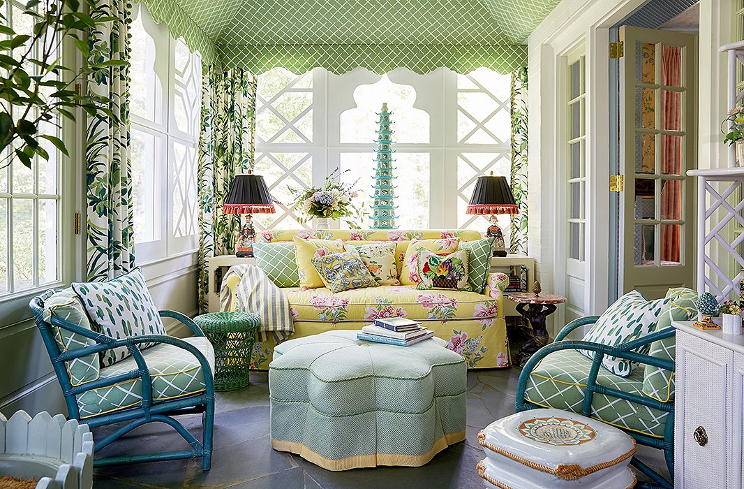 The sunroom is tented in Madcap Cottage’s Cove End fabric. “Who doesn’t love a tented room?” asks Jason. “It makes you feel like you’re a kid in your backyard minus that sprinkler that turned on at 2 o’clock in the morning.” They added a cheerful yellow sofa and casual rattan chairs. “The idea was to create a space that was fun and relaxed and made you happy,” he adds.
