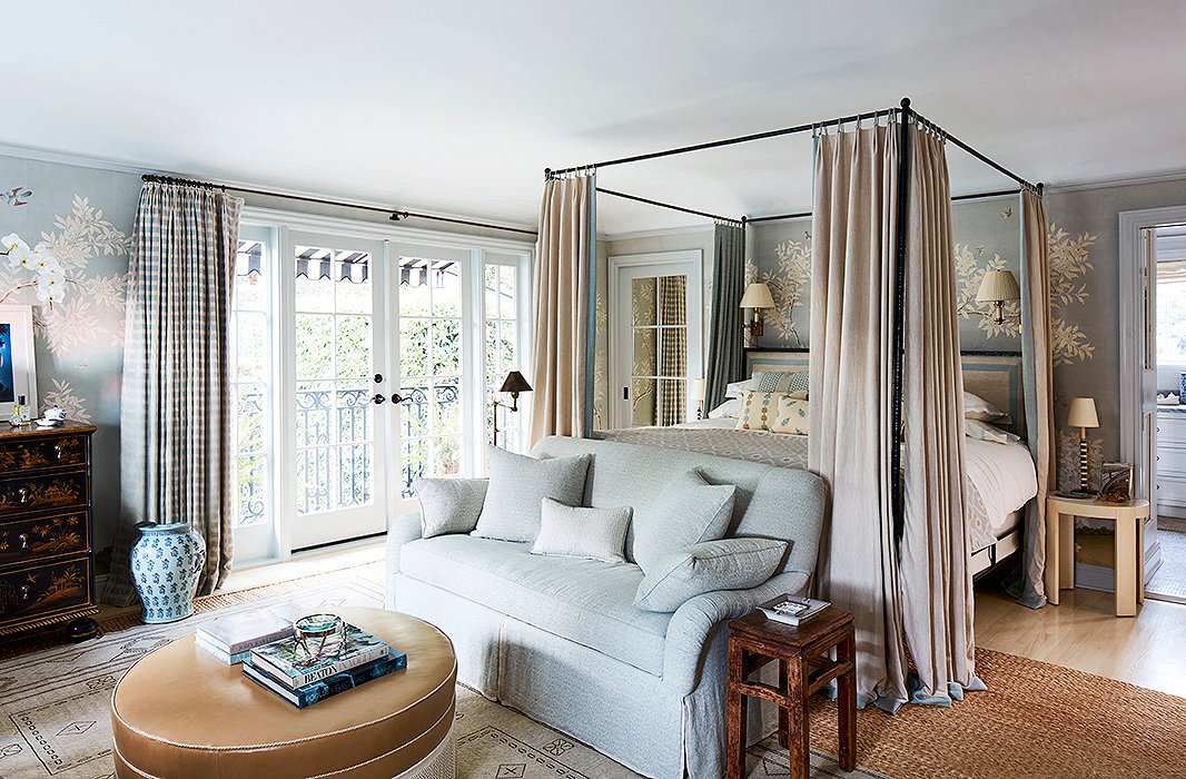 Mark’s favorite space, the master bedroom, is dressed in a Gracie paper. “I call it China blue and use it in many bedrooms because it’s so calming. This room is very functional. We made it bigger and added cabinetry. It’s truly a room we live in.” The settee and the ottoman are custom.
