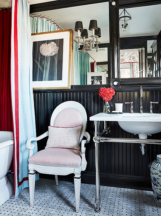 Glossy black beadboard lends Mark D. Sikes's Los Angeles bathroom a dose of Hollywood glam. Photo by Joe Schmelzer.  