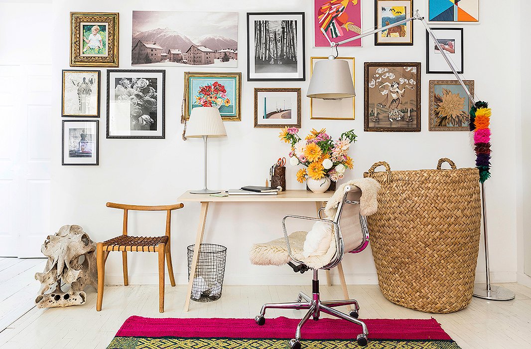 Jenni wanted to keep her home office simple, so she furnished the space with a clean-lined desk and a modern chair. She also installed an inspiration-packed gallery wall filled with photography, paintings, and family snapshots. “I always like big walls of different art,” she says. “Wherever we’ve lived I always try to do a collage of artwork.” 