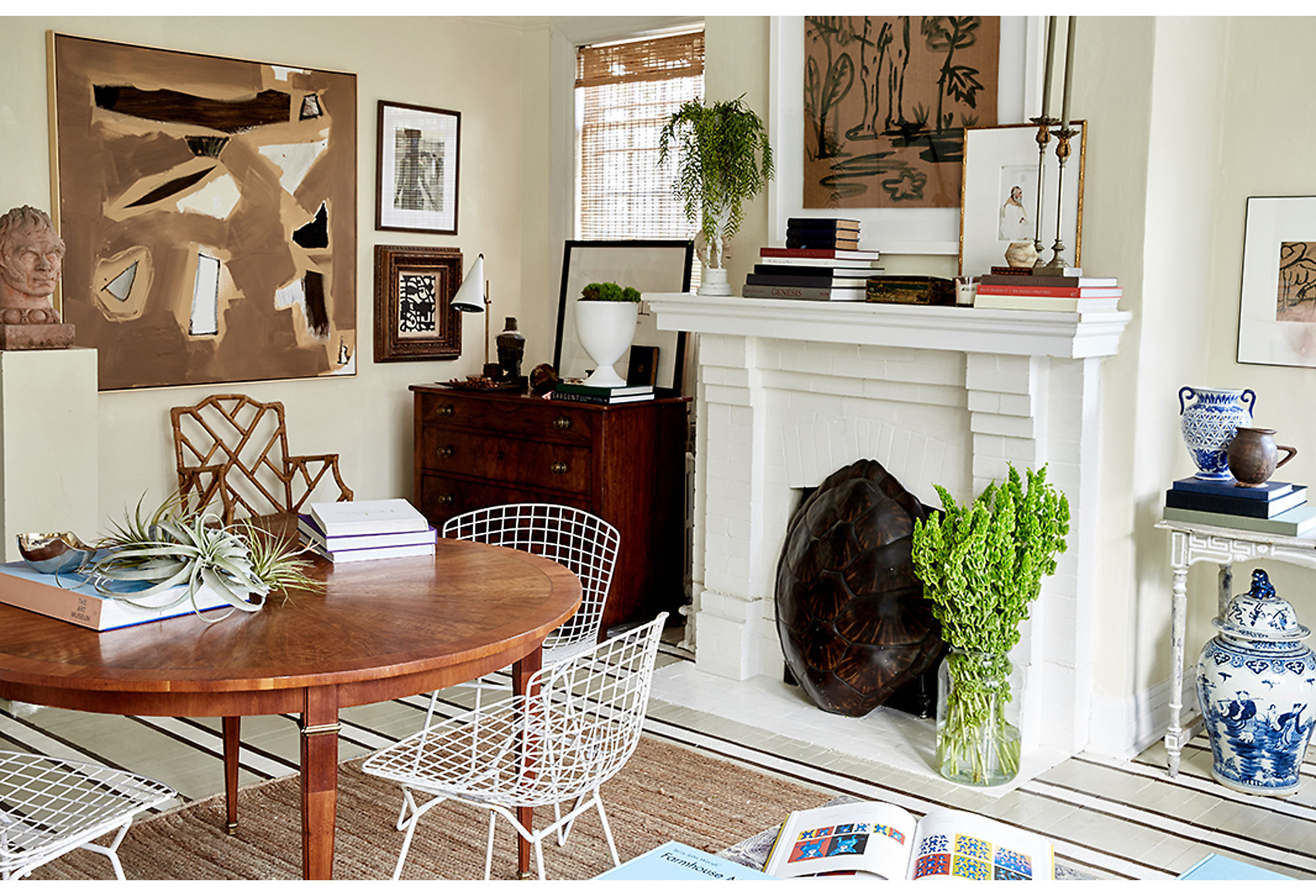 Small-space living often means living in an open floor plan where the living room, dining room, and kitchen all connect. If you stick to a cohesive color palette, as designer/artist William McClure did here in his Alabama home, you can seamlessly blend the combination space into a single design story. Photo by Frank Tribble.
