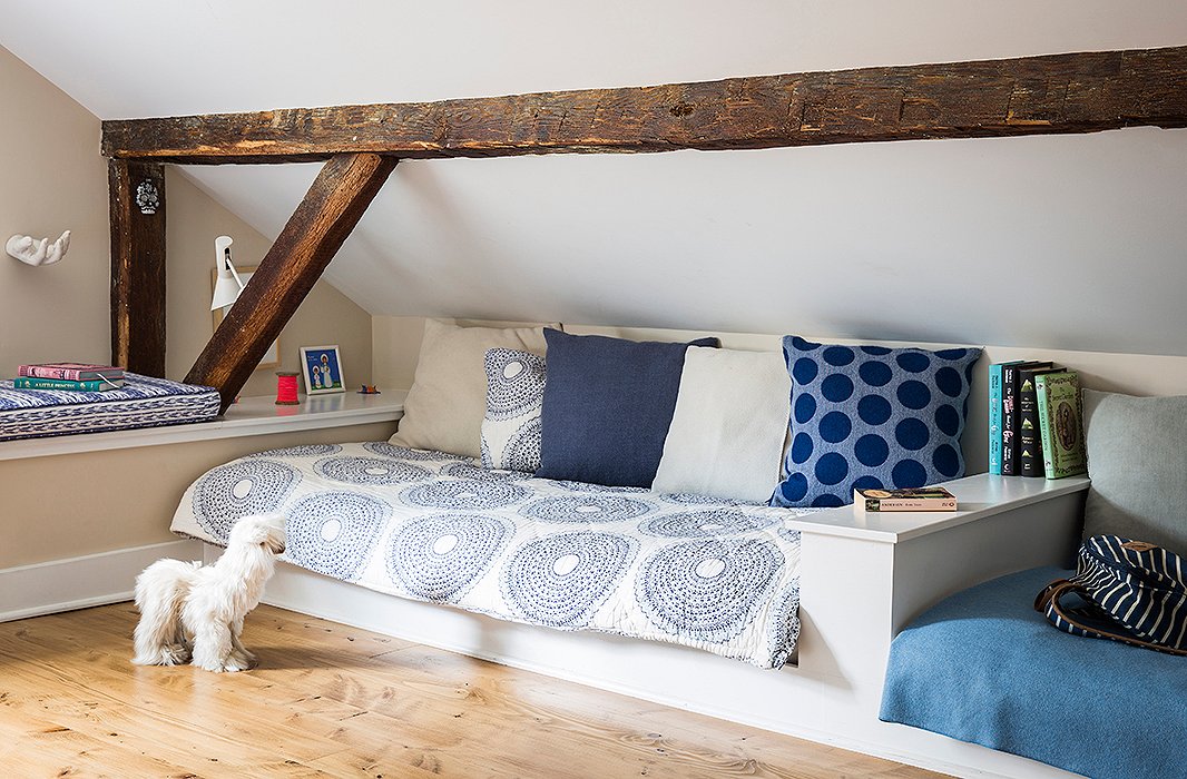 Alicia and Daniel carved a kids’ room out of the attic space, installing built-in beds and a desk. “The kids like that room a lot,” she says. “We had some fabric from India, and I combined it with some of our classic throws and pillows.”
