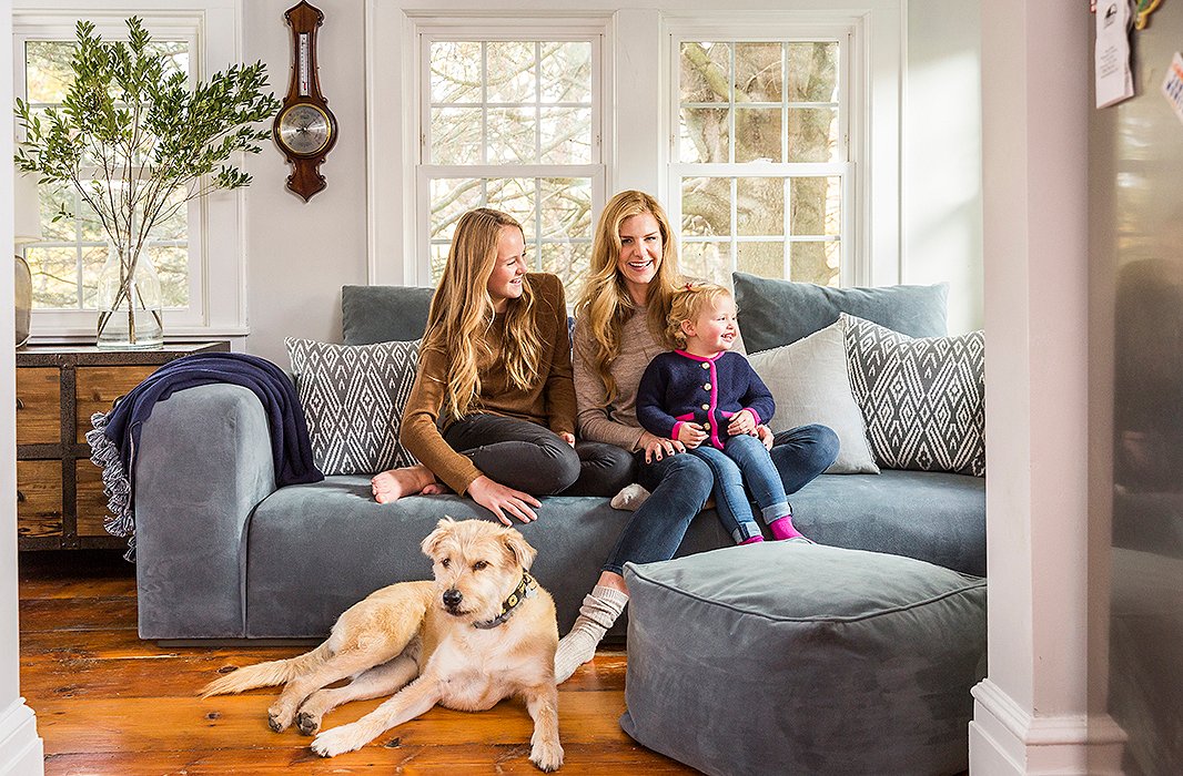 Alicia, Alana, and Alegra get comfy with Canela, the family rescue dog, in the seating area beside the kitchen. “I like to sit there mostly because I can see everything that’s going on in the house and the kitchen,” Alicia says.
