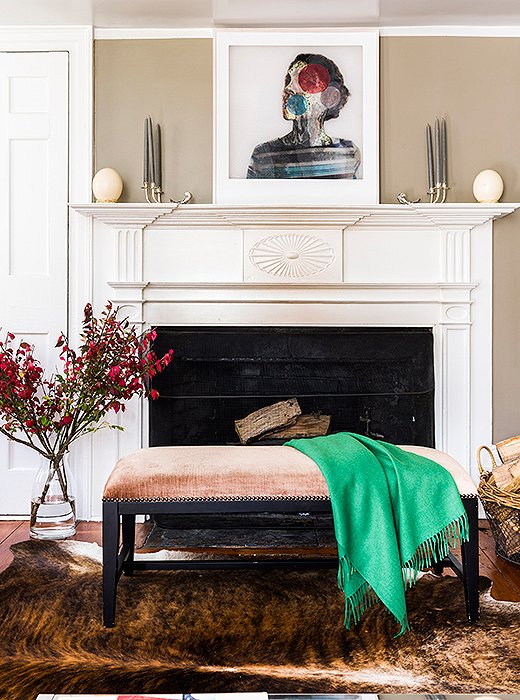 “We use the living room more in the fall and winter,” Alicia says. “We’ll all sit on the floor by the fireplace and play a game.” One of her colorful throws is draped across a bench from One Kings Lane.
