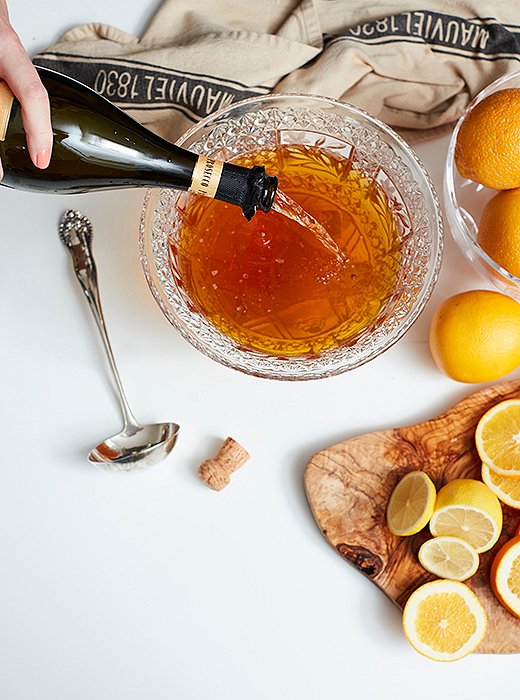 The best part is getting to pour loads of champagne. One advanced tip from Sylvia (not followed here): Make a circle of ice using a Bundt pan the night before the party, and use that to keep the punch cool in the bowl. If the mood strikes, add pineapple slices into the Bundt pan to give your ice a bit of personality.
