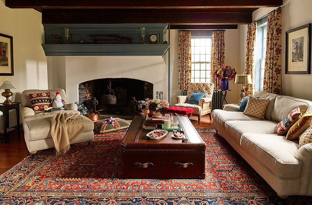 The snug living room is made even cozier through layers of textiles and plenty of plush seating. Built in the 17th century, the house is a prime example of historic Dutch architecture—so much so that the local historical society leads tours here several times a year.
