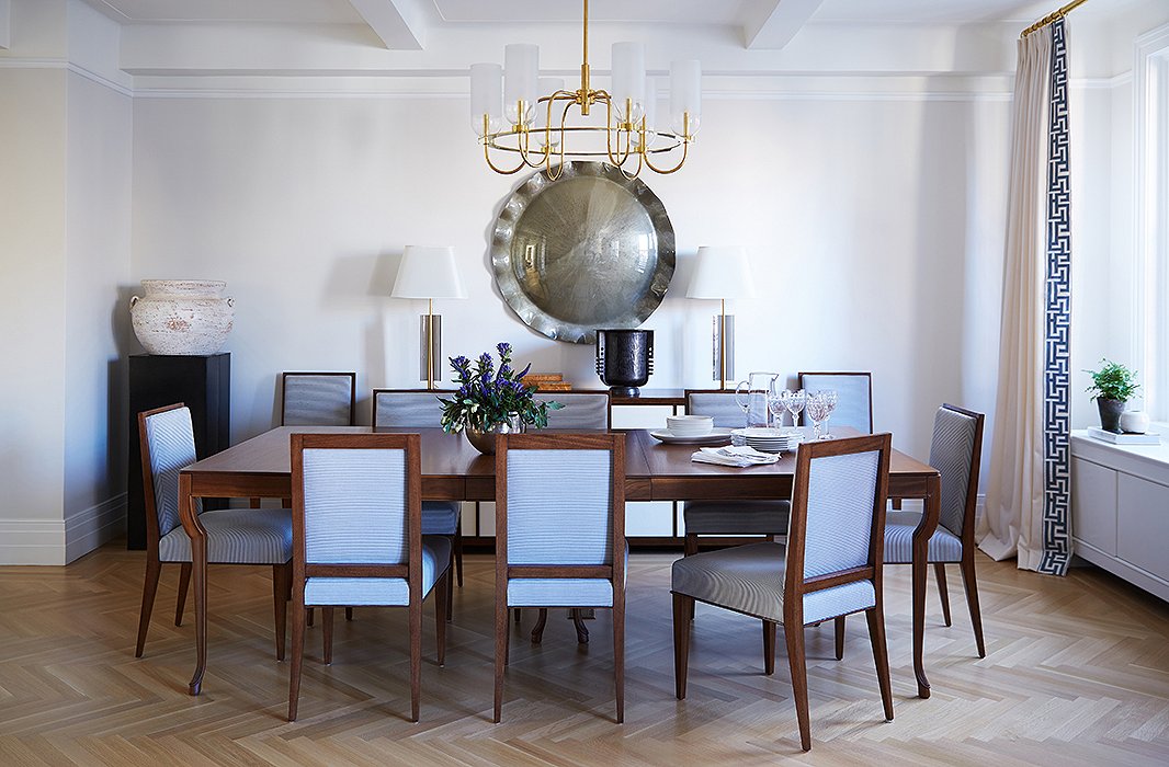 In the dining room, Alyssa and Vivian chose striking pieces, such as the convex mirror and the vintage table lamps, that could almost double as art. “We also have this beautiful glass chandelier to add warmth,” says Vivian.
