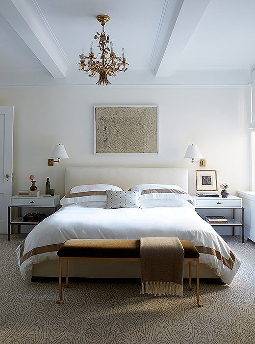 Gilded details and warm metals add a bit of restrained opulence to the master bedroom. “We didn’t want the apartment to fall flat because we weren’t using a lot of color,” explains Vivian. “The way we avoid that is in by playing with different textures. Metal is a great texture, although most people don’t think of it as a texture.”
