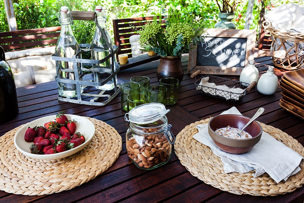 To make a table more personal, Stansfield cuts up linen napkins, emblazons them with custom rubber stamps, and uses them as basket liners.
