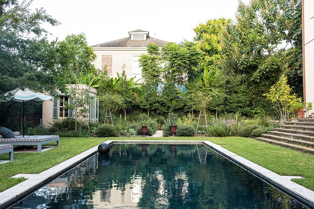 A darkened bottom gives this pool, set amid historic architecture, a statement-making, dramatic look. Photo by Nicole LaMotte.
