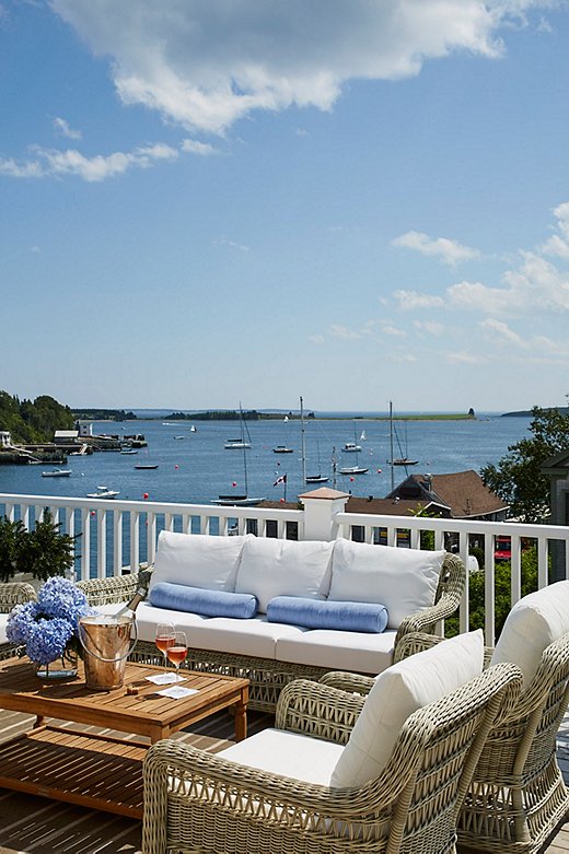 The third-floor deck, overlooking the harbor, is a favorite spot for entertaining—understandably so. The coffee table was a One Kings Lane purchase.
