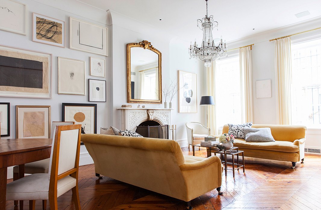The living area is set off by a pair of velvet George Smith sofas and a chandelier found at Clignancourt, the famed Paris flea market. Alison skipped a rug in favor of showing off the beautiful wood floors.
