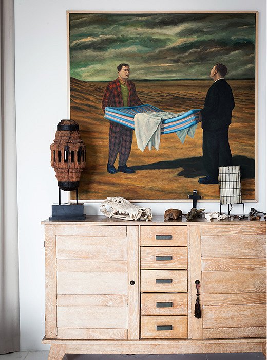 The large Surrealist painting, cheekily placed in the bedroom, was found in Australia.

