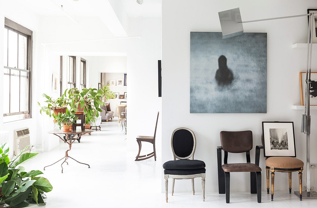 A large-scale photograph by Israeli artist Michal Rovner has remained a focal point and fixture in the apartment, as has the 1960s Italian floor lamp.
