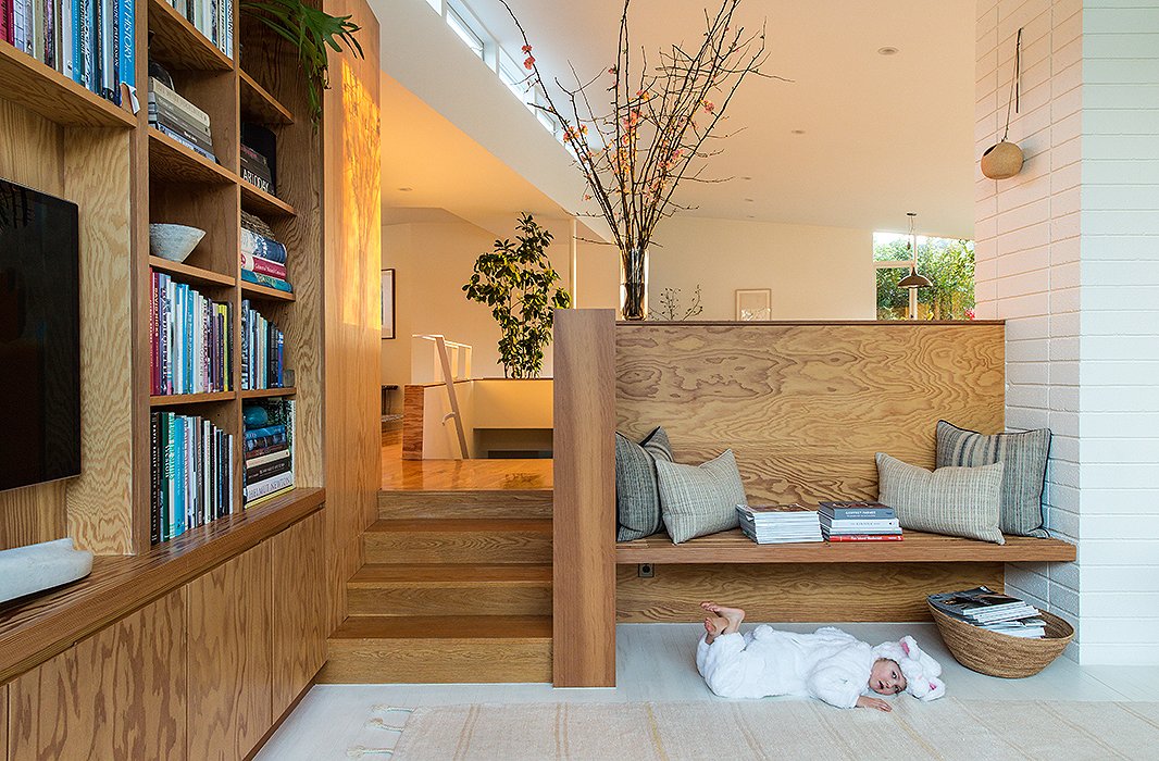 James (in bunny disguise) lounges beneath one of the home’s many built-ins. Baskets in all shapes and sizes are another common sight. “Can’t resist a good basket,” laughs Jessica. “The bigger floor baskets with magazines are from Dream Collective in Silver Lake and Hollace Cluny in Toronto.”
