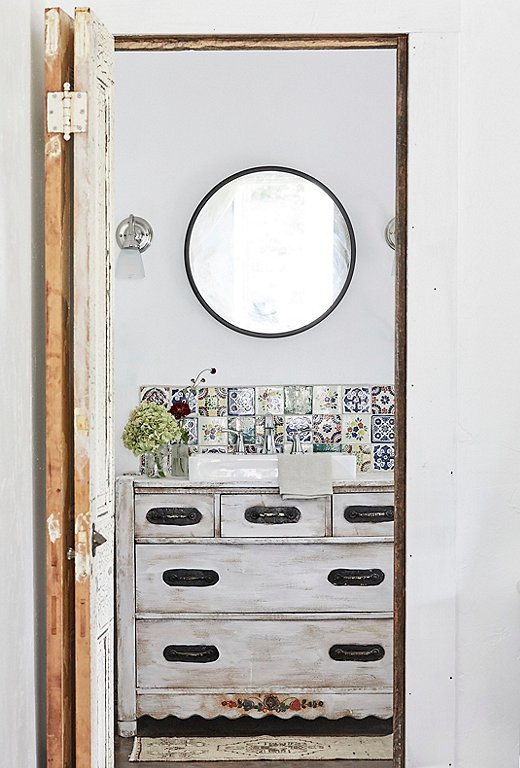 Vintage Spanish-inspired tiles add a hint of color to the bathroom of #405 Whispering Trails.
