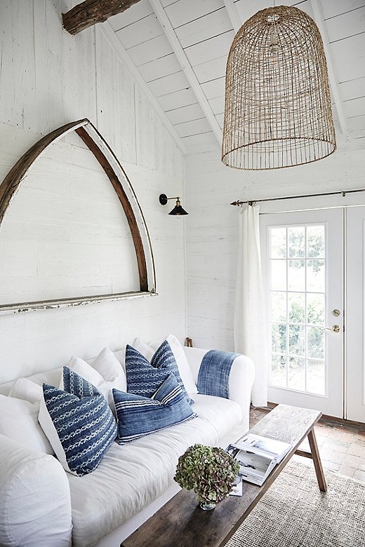 Pillows from Tammy’s indigo collection lend a pop of color to the living room of #22 Whispering Trail, one of the Prairie’s inviting cottages. 
