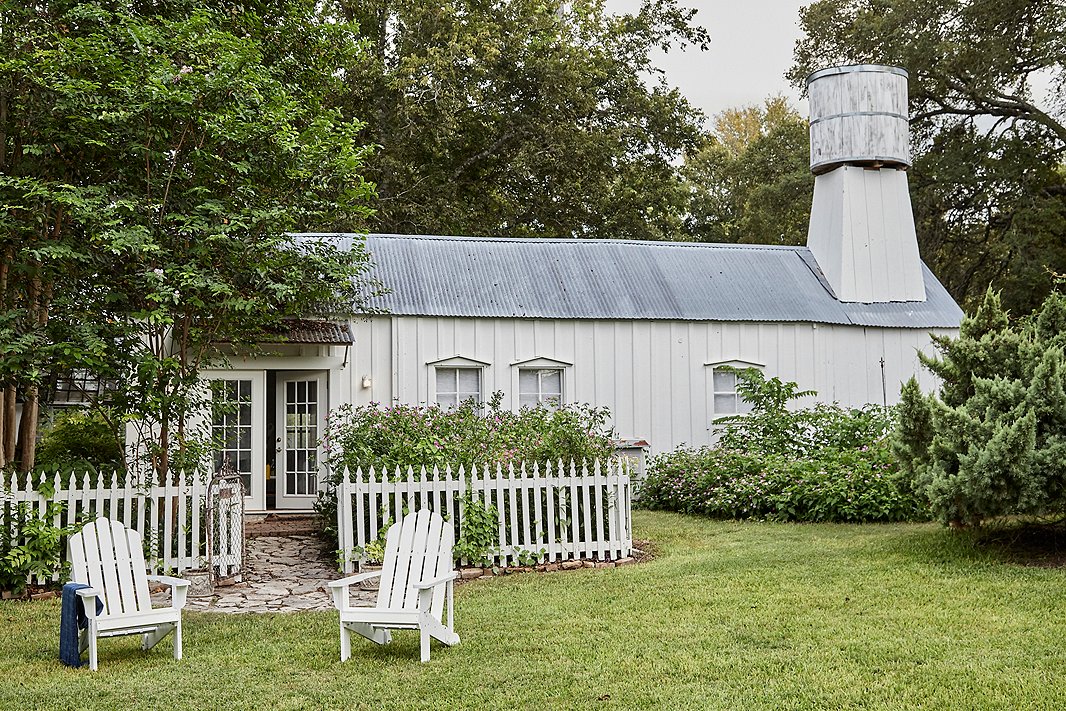 Classic Adirondack chairs provide the perfect spot to relax in front of #22 Whispering Trail. 
