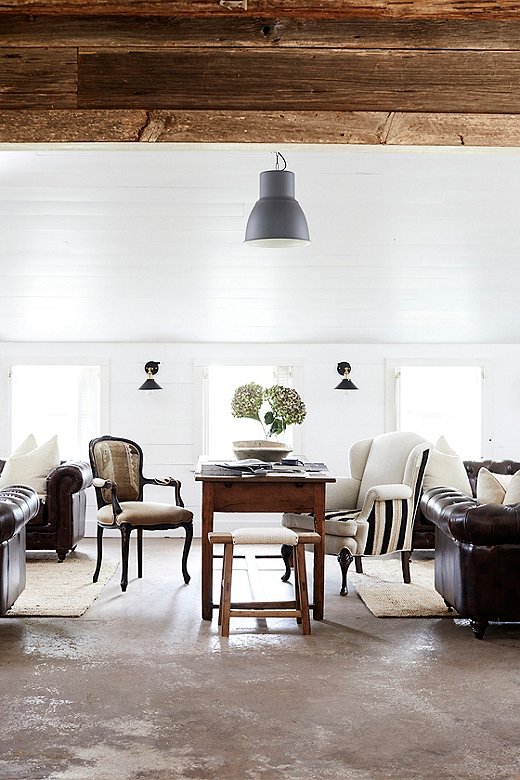 The Guest House, originally a hay barn (as evidenced by its restored rusted-tin siding and roof), now serves as the property’s main gathering place.

