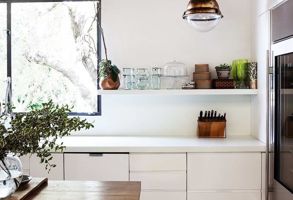 For anyone else, a glass-fronted fridge might seem off-putting, but for Kayne and her husband, it works with their aesthetic. “We are Virgos, so we love for everything to look perfect,” she says. “I keep out tons of Weck jars and a cake stand to put baked goods on.”