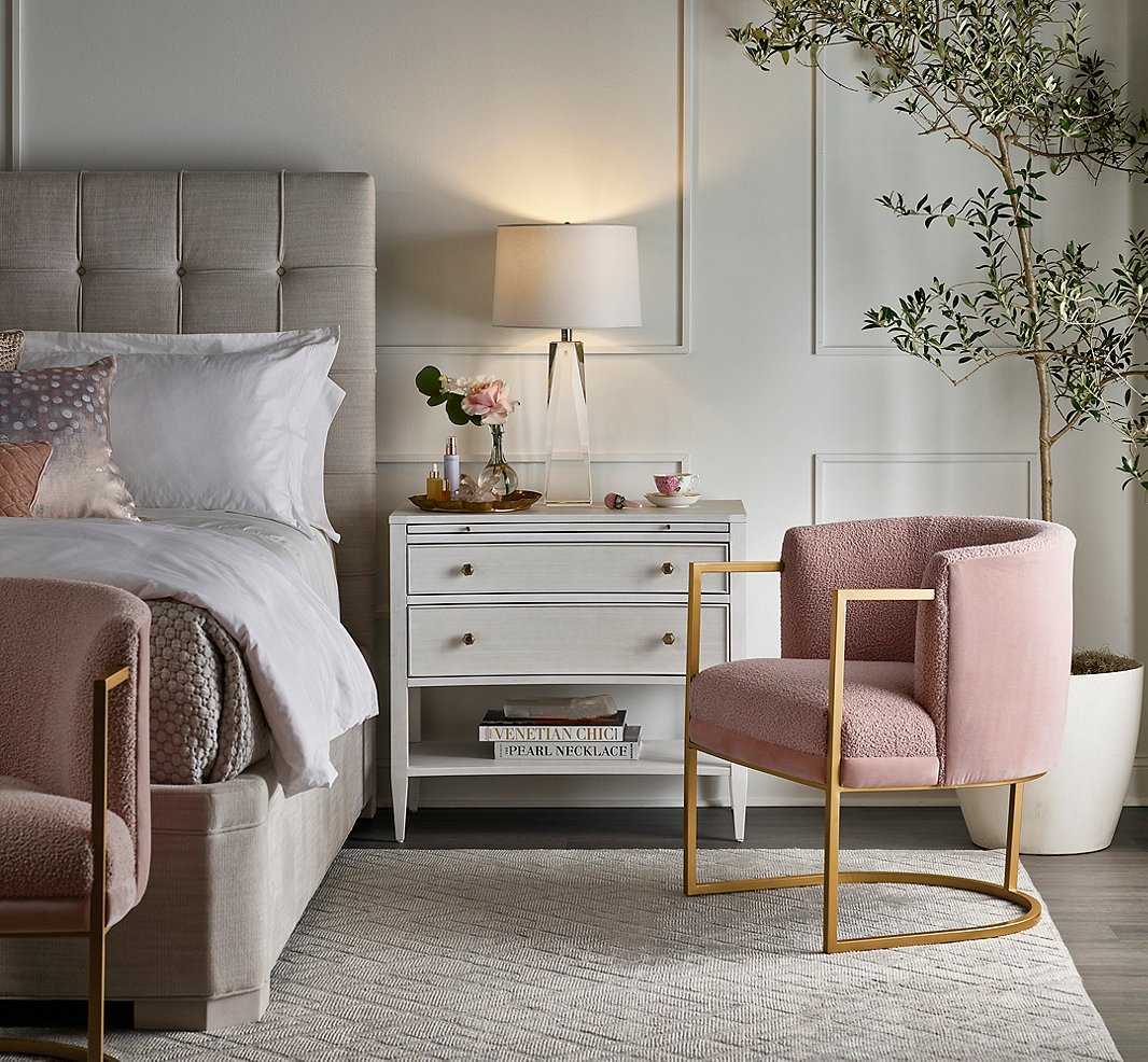 “I love the blush pink color used on the Cali Accent Chair,” Miranda says. “It reminds me of rose quartz crystal, which is my favorite crystal, as it’s the stone of love. On this chair you also have the tactile experience of the different fabrics used—the knobby bouclé fabric on the front and the soft velvet fabric on the back.” Also shown: the Uptown Bed and the Chelsea Nightstand.
