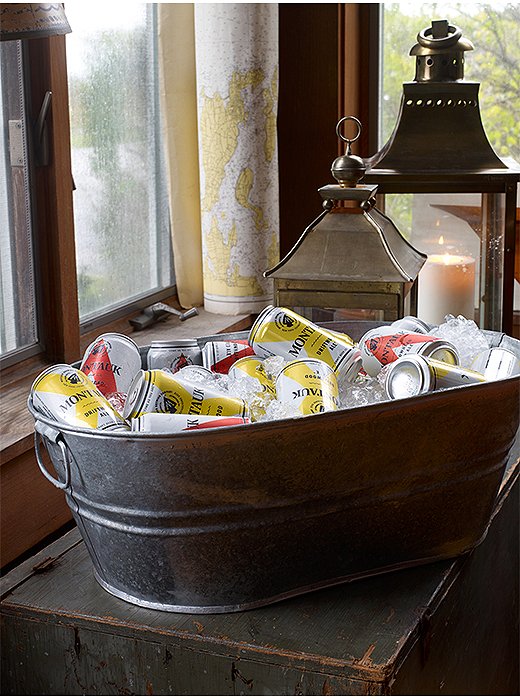 Easier than a cocktail but just as pretty, a tub full of ice and Montauk Ale brings the beachy vibe inside. Put one out and let guests help themselves.
